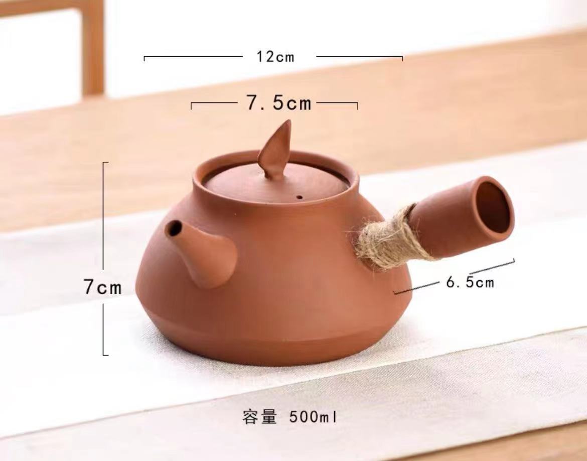 This is a pottery side handle kettle