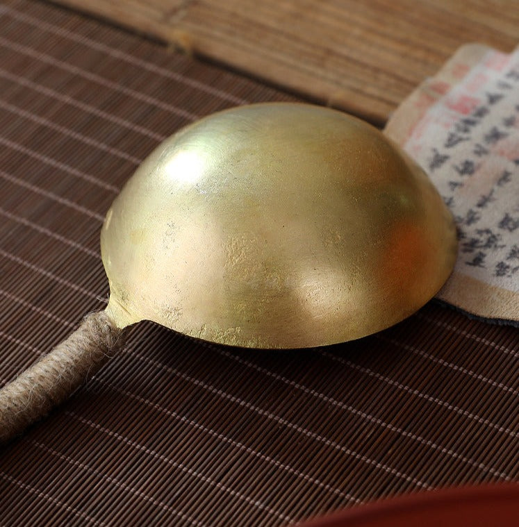 This is a copper tea scoop