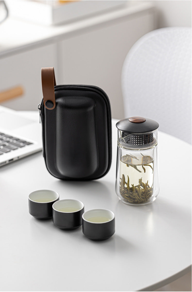 This is a glass teapot travel set