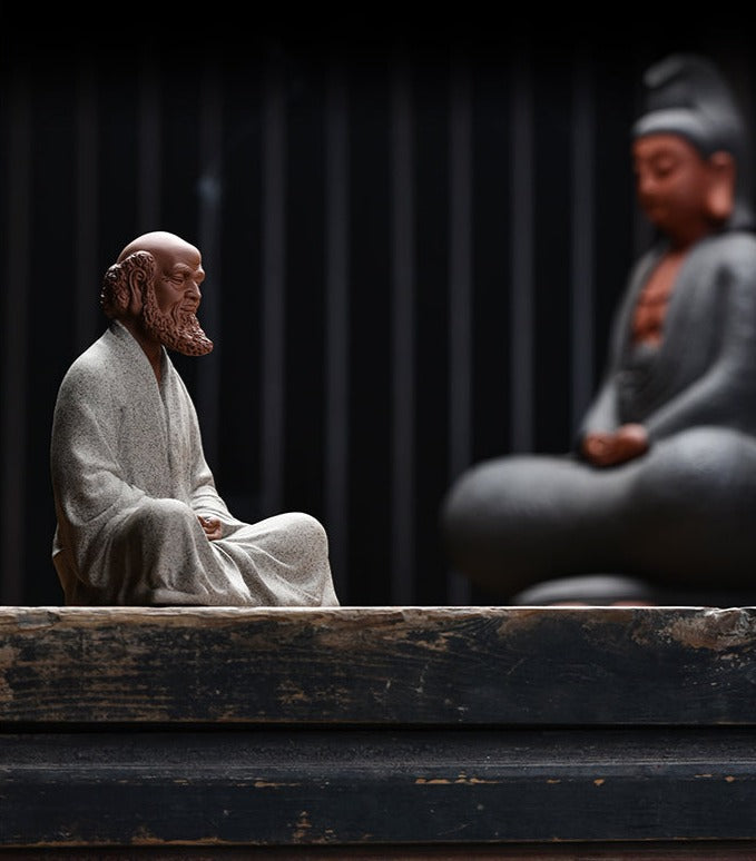 this is a pottery mini bodhidharma sculpture