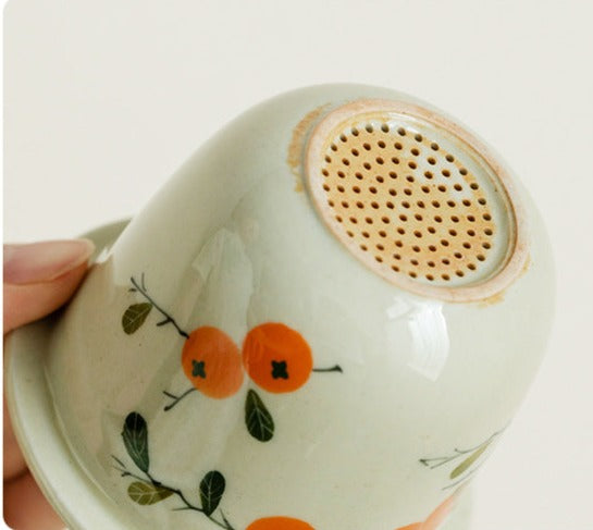 This is a ceramic teapot travel set