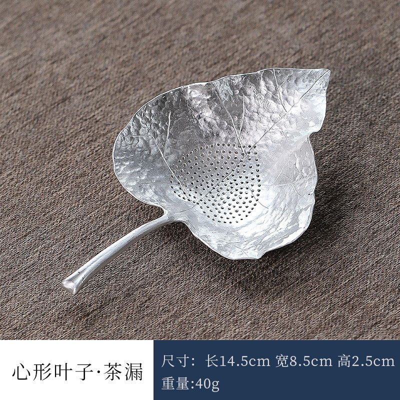 This is a tin tea scoop tea filter