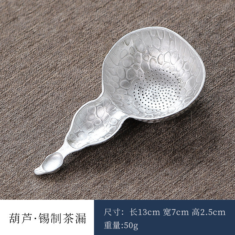 This is a tin tea scoop tea filter