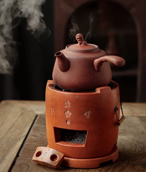 This is a pottery side handle kettle