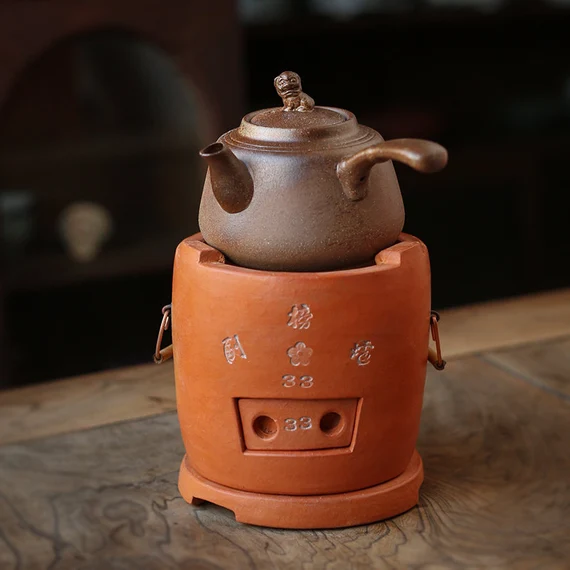 This is a pottery side handle kettle