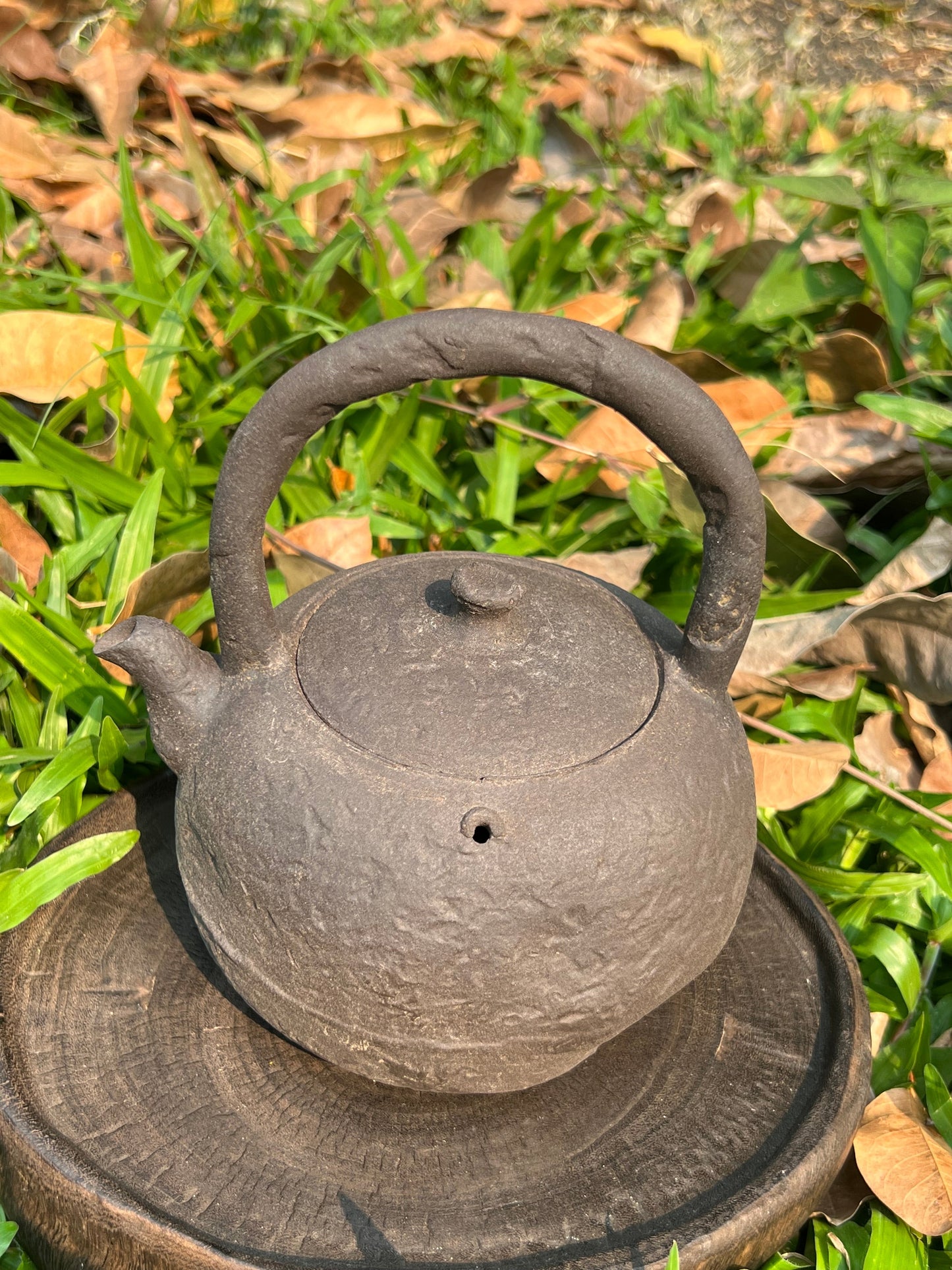 This is a pottery lifting handle kettle 