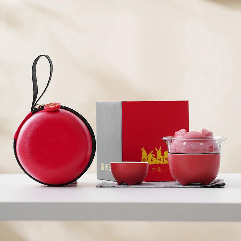 This is a ceramic teapot travel set