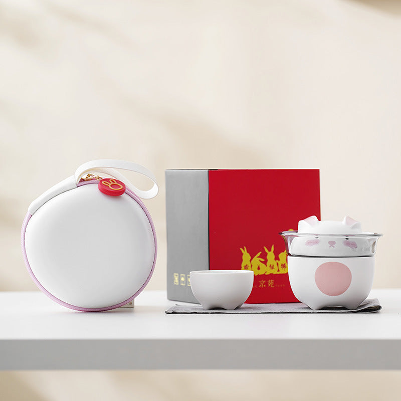 This is a ceramic teapot travel set