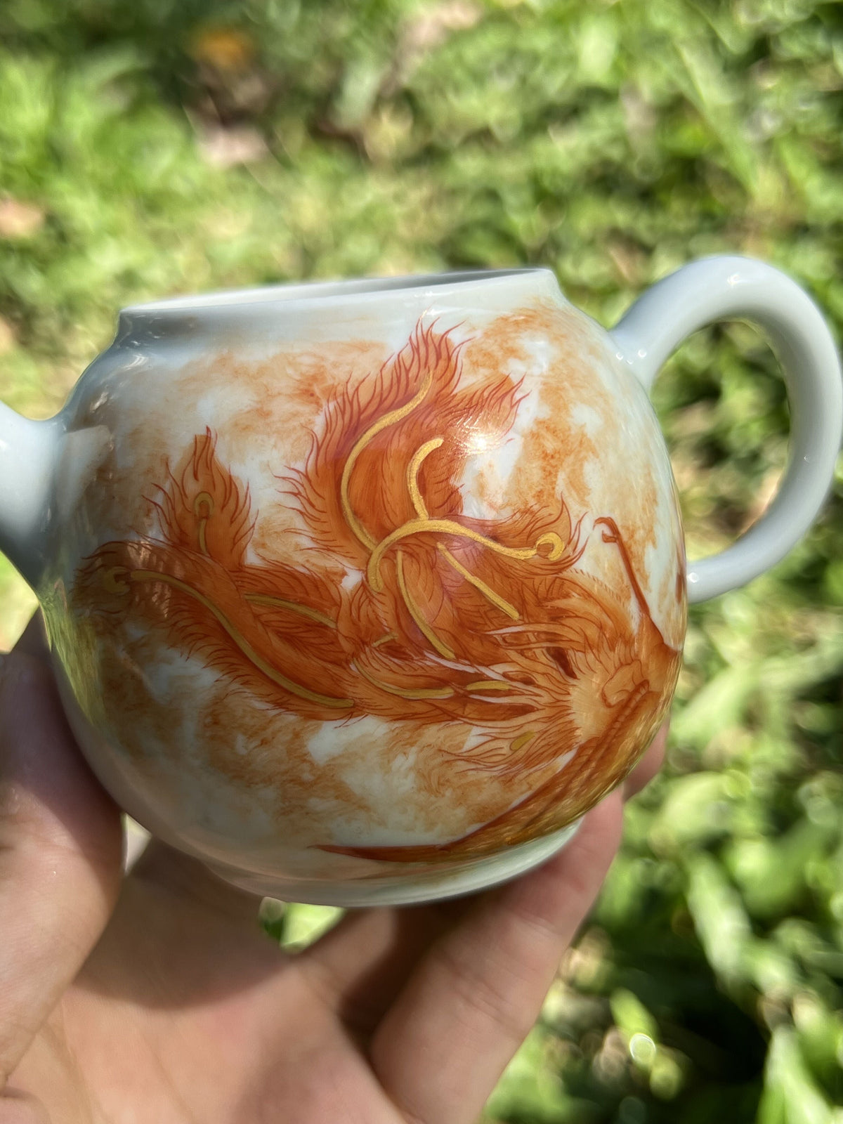 this is a Chinese Jingdezhen alum red phoenix teapot.this is a ceramic teapot