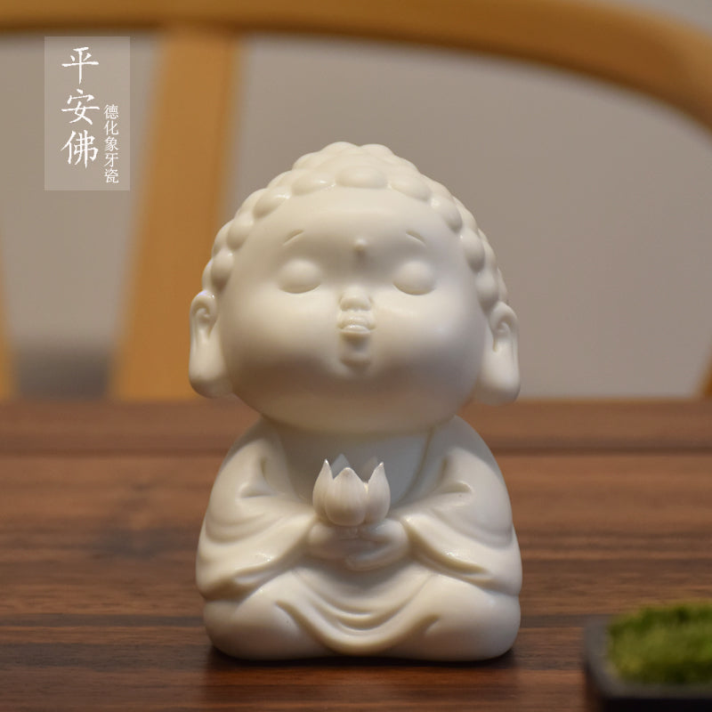 This is a white porcelain buddha teapet incense holder