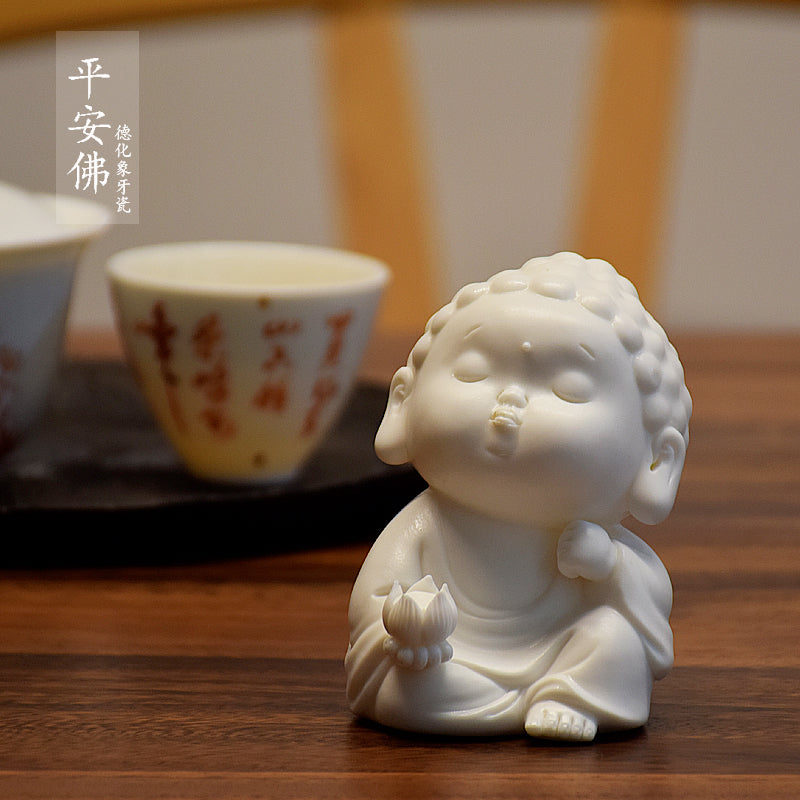 This is a white porcelain buddha teapet incense holder