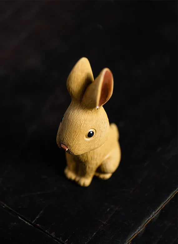 This is a Yixing purple clay rabbit teapet