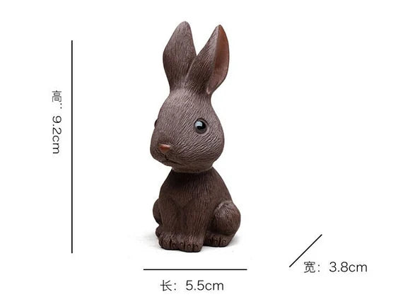 This is a Yixing purple clay rabbit teapet