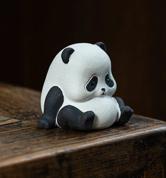 This is a Yixing purple clay panda teapet