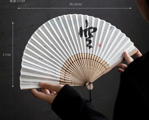 This is a bamboo cotton linen folding fan