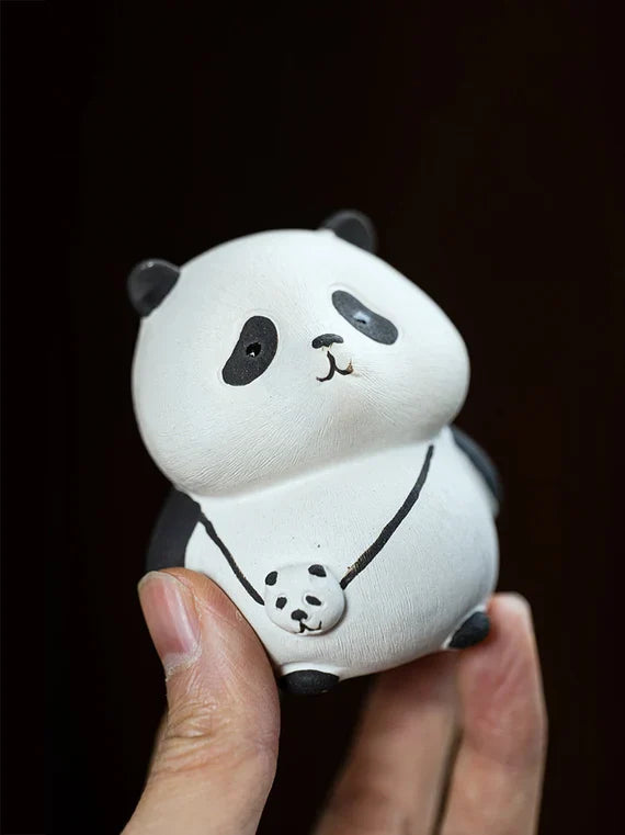 This is a Yixing purple clay panda teapet