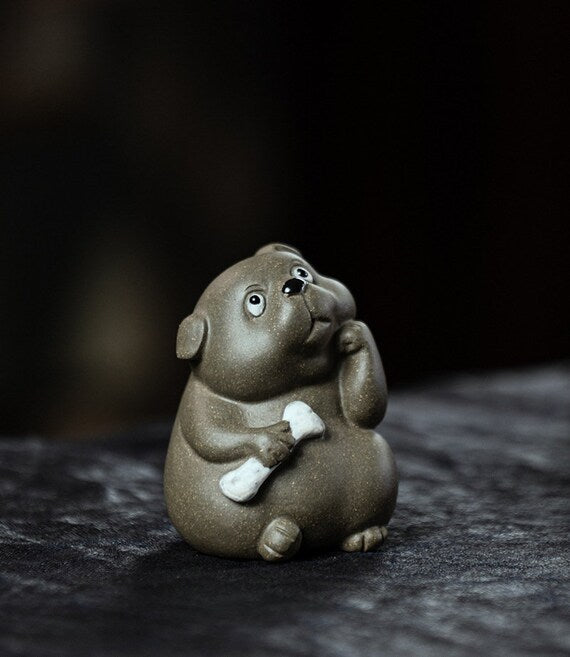 This is a Yixing purple clay dog teapet