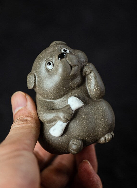 This is a Yixing purple clay dog teapet