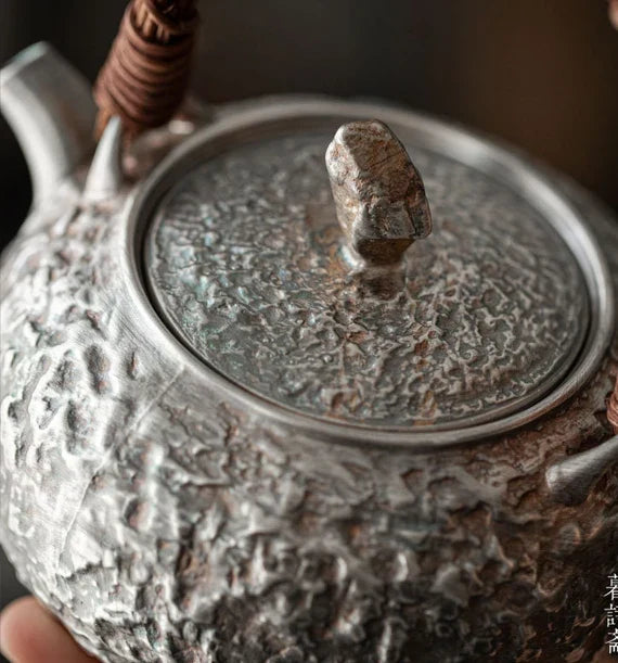 This is a gilted silver kettle 