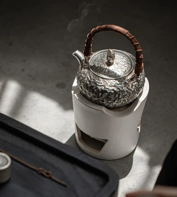 This is a gilted silver kettle 