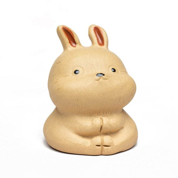 This is a Yixing purple clay rabbit teapet