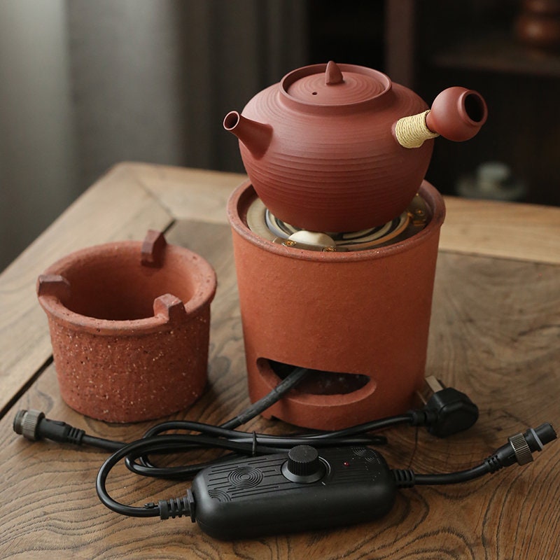 This is a pottery side handle kettle