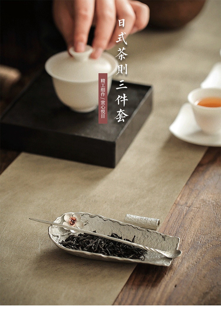 This is a tin tea scoop