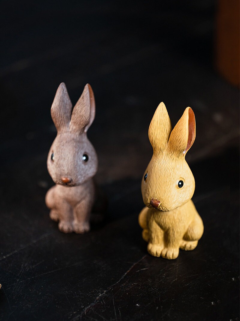 This is a Yixing purple clay rabbit teapet