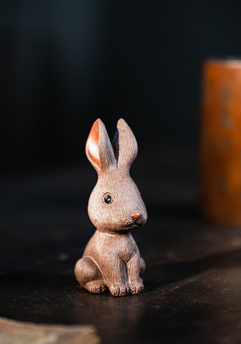 This is a Yixing purple clay rabbit teapet