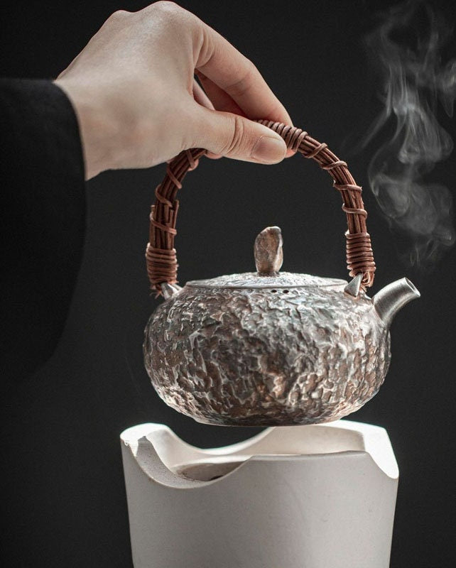 This is a gilted silver kettle 